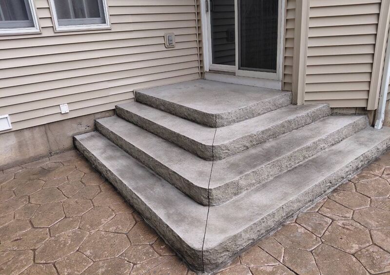 Cascading rock face concrete steps random stone stamped patio