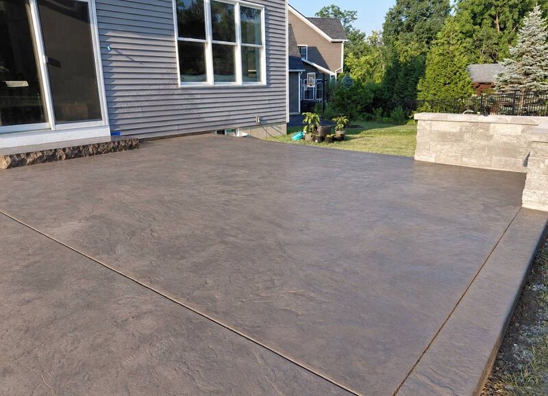 Brown slate stamped patio gray siding stone veneer pillar