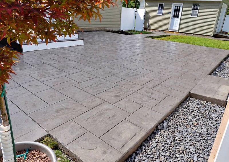 Gray ashlar stamped patio japanese maple gravel bed