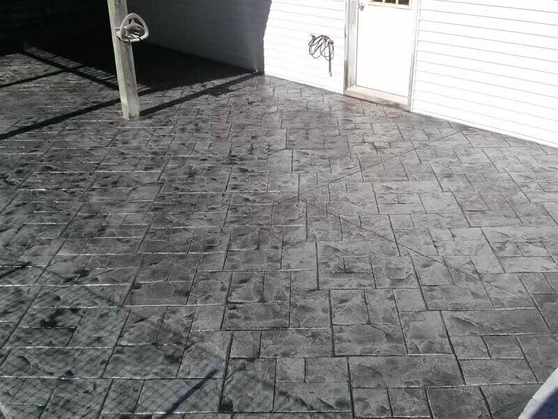 Dark charcoal stamped ashlar patio