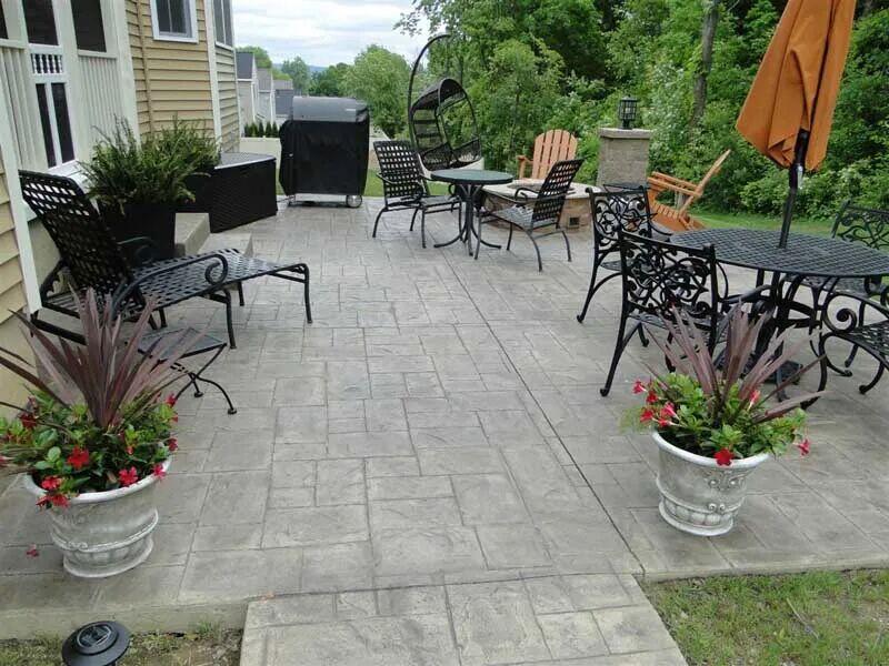 Ashlar stamped patio with furniture and planters