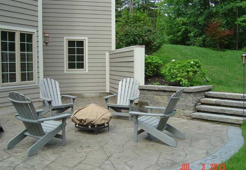 Stamped patio with adirondacks and firepit