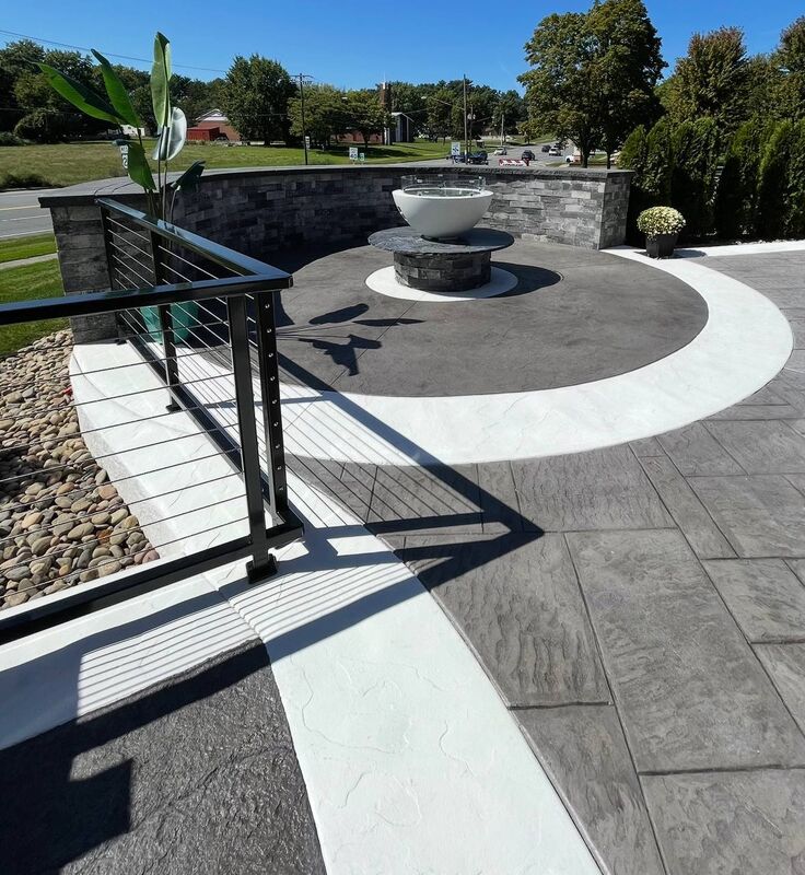 Patio circle inlay fire bowl stone wall cable rail