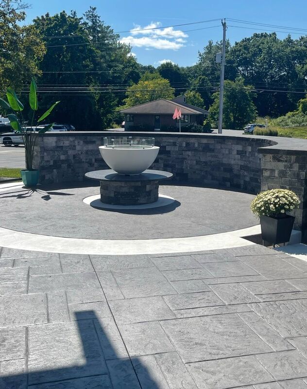 Patio fire bowl circle inlay curved stone wall
