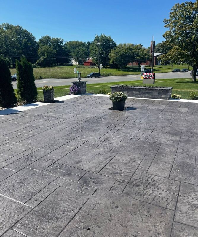 Large stamped ashlar patio fire feature planters