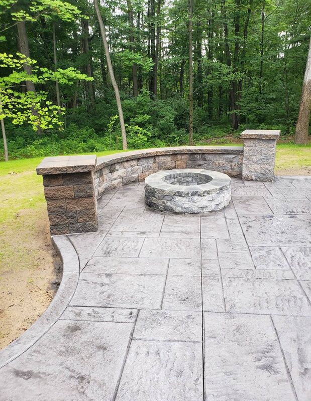 Patio fire pit curved seat wall pillars wooded