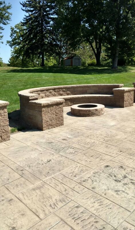 Patio curved seat wall fire pit daylight