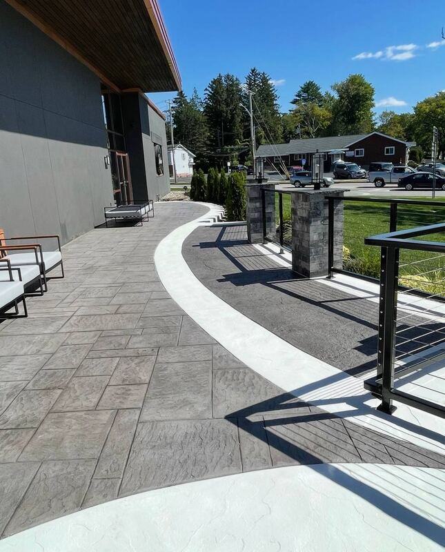 Stamped walkway with white border, cable rail and pillars