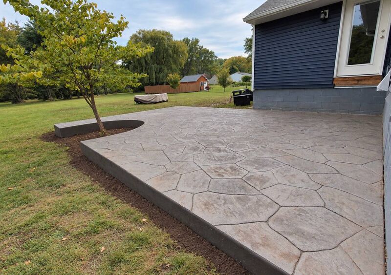 Random flagstone stamped patio tree cutout navy house